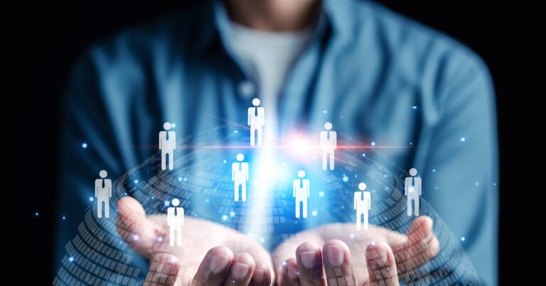 Business person with a network of people in his hands.